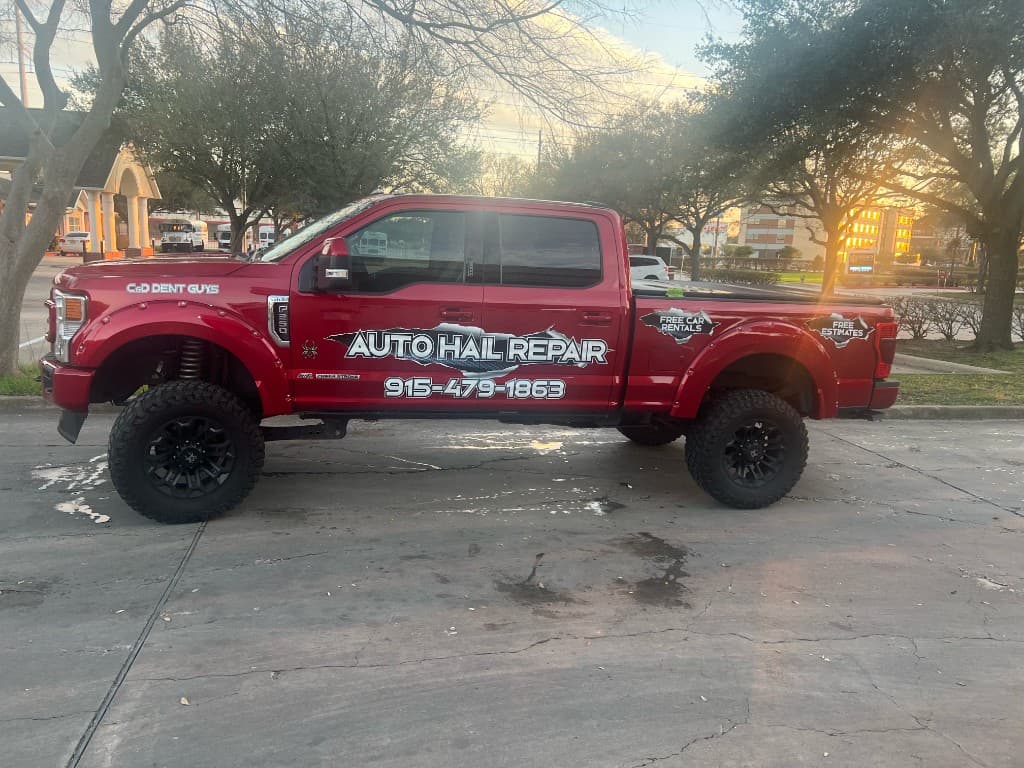 C & D Dent Guys branded red Ford Super Duty truck at sunset — Auto Hail Repair 915-221-1785