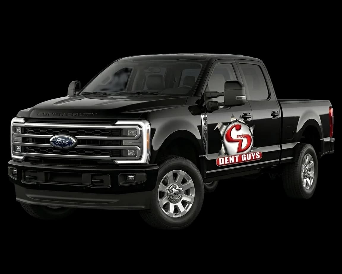 Black Ford Super Duty crew cab truck with C & D Dent Guys branding — paintless dent repair service vehicle in El Paso, TX